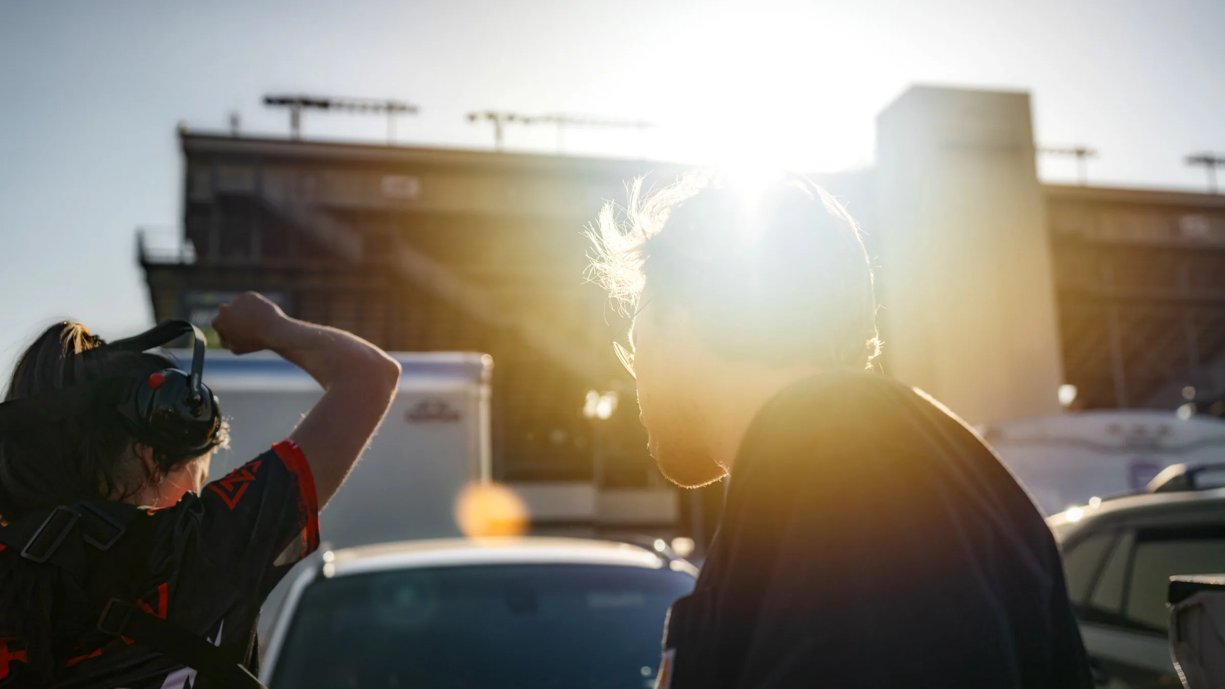 Backlit crew and paddock moment